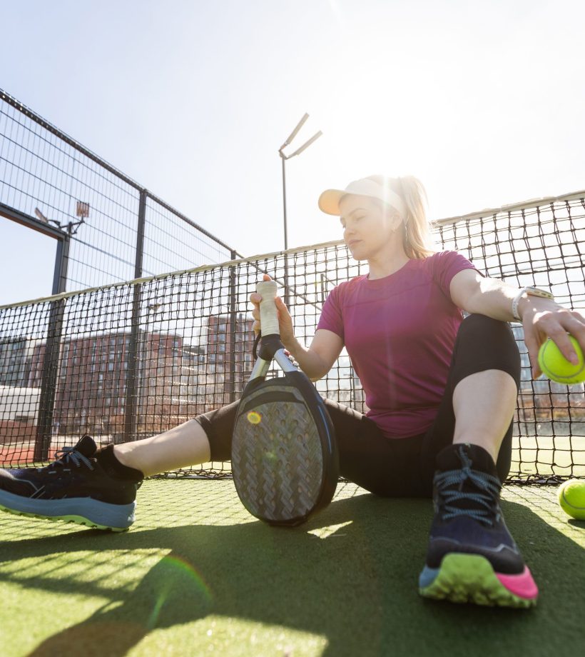 One women playing Paddle tennis. High quality photo